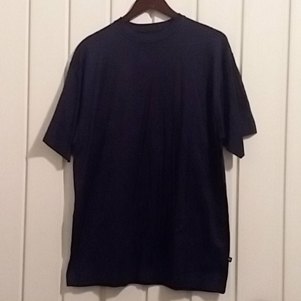 Blacker, navy blue tee shirt.